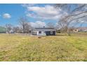 Expansive backyard with lush green grass, perfect for outdoor activities and relaxation at 2230 W 6Th Ave, Gastonia, NC 28052