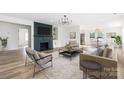 Bright living room with modern fireplace, stylish furnishings, and open-concept design at 2230 W 6Th Ave, Gastonia, NC 28052
