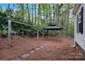 Secluded backyard offering a charming gazebo surrounded by mature trees and landscaping at 2749 Old Nation Rd, Fort Mill, SC 29715