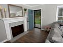 Cozy entryway with fireplace, light gray walls and wood-look flooring at 436 Old Nc 90 Hwy, Taylorsville, NC 28681