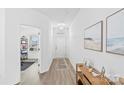 Bright and open hallway with hardwood floors, modern lighting, and stylish decor at 5104 Thomasville Dr, Belmont, NC 28012