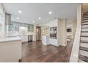 Bright, modern kitchen features stainless steel appliances, ample counter space, and dark hardwood floors at 8308 Knights Bridge Rd, Charlotte, NC 28210