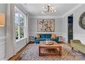 Cozy living room with hardwood floors, large window, and stylish decor at 835 Ryans Pl, Fort Mill, SC 29715
