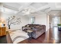 Spacious living room featuring a decorative ceiling, hardwood floors, and an elegant wall design at 10161 Castlebrooke Dr, Concord, NC 28027