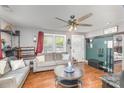 Inviting living room showcasing a ceiling fan, gray sofas, and hardwood floors at 206 Friedheim Rd, Rock Hill, SC 29730