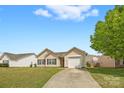 Charming single-story home featuring a well-maintained lawn and attached one car garage at 2659 Captains Watch Ne Rd, Kannapolis, NC 28083