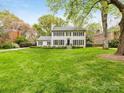 Beautiful two-story home with lush green lawn and mature trees at 2912 Wheelock Rd, Charlotte, NC 28211