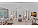 Bright living room with vaulted ceilings, painted fireplace, and neutral decor at 2915 Cross Country Rd, Charlotte, NC 28270