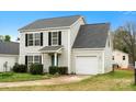 Charming two-story home with black shutters, a green front door, and an attached one-car garage at 3320 Alderknoll Ct, Charlotte, NC 28216