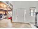 Bright foyer featuring high ceilings, a light wood floor, and a view into the adjacent office at 3383 Norwich Rd, Fort Mill, SC 29715