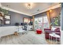 Stylish office with a large window, unique wallpaper, and a comfortable seating area at 3383 Norwich Rd, Fort Mill, SC 29715