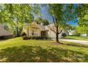 Lovely single-story home featuring a lush green lawn and mature trees in a serene setting at 3411 Xandra Ct, Indian Land, SC 29707