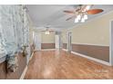 Spacious living room with hardwood floors, ceiling fans, and natural light from the windows at 394 Efird St, Gastonia, NC 28054