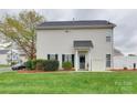 Inviting residence with freshly cut lawn, tidy landscaping, and stylish exterior accents at 4130 Town Center Rd, Harrisburg, NC 28075