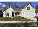 Charming single-Gathering home with a two-car garage and well-manicured lawn at 5126 Rocky River Crossing Rd, Harrisburg, NC 28075