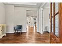 Open foyer with hardwood flooring, chair rail detail, and a glimpse of the staircase at 6654 Maple Spring Ct, Denver, NC 28037