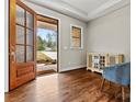 Foyer with gleaming hardwood floors, natural light, and a view of the landscaped front yard at 6654 Maple Spring Ct, Denver, NC 28037