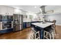 Modern kitchen with stainless steel appliances, island and stylish cabinetry at 9718 Barkridge Rd, Mint Hill, NC 28227