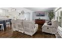 Comfortable living room with hardwood floors and a mounted television at 9718 Barkridge Rd, Mint Hill, NC 28227