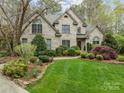 Handsome brick home with a well-manicured lawn and lush landscaping, offering timeless curb appeal at 104 Chalfont Ct, Salisbury, NC 28147