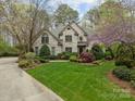 Stately brick home with well-maintained lawn, mature trees, and colorful landscaping in a desirable neighborhood at 104 Chalfont Ct, Salisbury, NC 28147