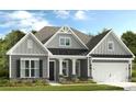 Charming single-Gathering home showcasing stone accents, a covered porch, and a two-car garage at 1110 Sugar Creek Rd, Indian Land, SC 29707