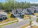 Stunning aerial view of the home showcasing its location in a quiet neighborhood with manicured lawns at 12526 Dunloe Wood Dr, Huntersville, NC 28078