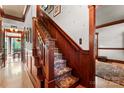 Elegant staircase with intricate wood detailing and patterned carpet runner at 1536 Bear Mountain Rd, Charlotte, NC 28214