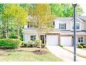 Inviting two-story townhome with a stone veneer, a well-kept lawn, and mature trees in a verdant setting at 162 Limerick Rd # C, Mooresville, NC 28115