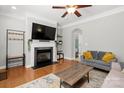 Inviting living room featuring a fireplace, hardwood floors, and comfortable seating at 164 Singleton Rd, Mooresville, NC 28117