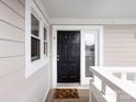 Front door of the unit with a black door, white trim, and unit number three at 2719 Selwyn Ave # 3, Charlotte, NC 28209
