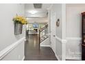Bright entryway showcasing hardwood floors and staircase leading to a welcoming living space at 4004 Henshaw Rd # 448, Waxhaw, NC 28173