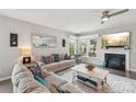 Inviting living room featuring a fireplace, ample natural light, and stylish neutral decor at 4004 Henshaw Rd # 448, Waxhaw, NC 28173