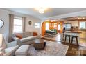 Inviting living room featuring stylish furnishings and an open layout into the dining area and kitchen at 4244 Donnybrook Pl, Charlotte, NC 28205