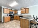 Functional kitchen with stainless steel appliances, a center island, and wood cabinets at 4285 Palmer Lloyd Rd, Lancaster, SC 29720