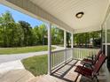 Relaxing front porch with outdoor seating and a scenic view of the surrounding landscape at 4285 Palmer Lloyd Rd, Lancaster, SC 29720