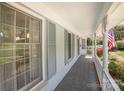 Inviting covered front porch with patterned flooring and views of the landscaped yard at 726 Grandview Ne Dr, Concord, NC 28025