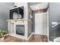 Inviting living room showcasing a fireplace, TV, and front door access at 9052 Meadowmont View Dr, Charlotte, NC 28269