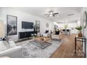 Bright and airy living room with modern furnishings, seamlessly flowing into the open kitchen area at 1034 Dooley Dr, Charlotte, NC 28227