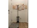 Hallway featuring a coat rack, neutral decor, and hardwood floors at 123 Grey Fox Ln, Mount Gilead, NC 27306