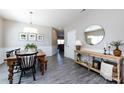 Open dining room with a wooden table, stylish chairs, and decor, leading into a cozy living area at 325 Crandon Rd, Mount Holly, NC 28120
