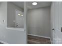 Bright entryway with neutral gray walls and wood-look flooring at 3835 Mohawk Ct, Charlotte, NC 28215