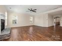 Spacious living room with hardwood floors and stone fireplace at 4006 Fall Oak Ter, Fort Mill, SC 29707