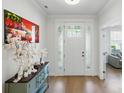 Bright foyer with wood flooring and beautiful accent pieces that lead into the home at 4120 Spring Cove Way, Belmont, NC 28012