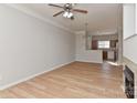 Spacious living room with wood floors, ceiling fan and fireplace at 6512 Quarterbridge Ln, Charlotte, NC 28262