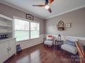 Cozy living room with hardwood floors, and natural light, perfect for relaxation at 7138 Dove Field Ln, Indian Land, SC 29707