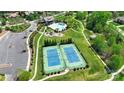 Aerial view of community amenities, including tennis courts, a pool, and a playground at 8313 Balcony Bridge Rd, Huntersville, NC 28078