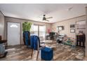 Cozy living room with wood-look flooring, comfortable seating, and natural light at 980 Lakeland Ave, Lincolnton, NC 28092