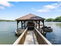 Private boat dock with covered slip offering convenient access to the water and recreational opportunities at 1328 Astoria Pkwy, Catawba, NC 28609
