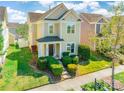 Inviting two-story home with manicured lawn and cozy porch, perfect for suburban living at 16431 Leavitt Ln, Davidson, NC 28036